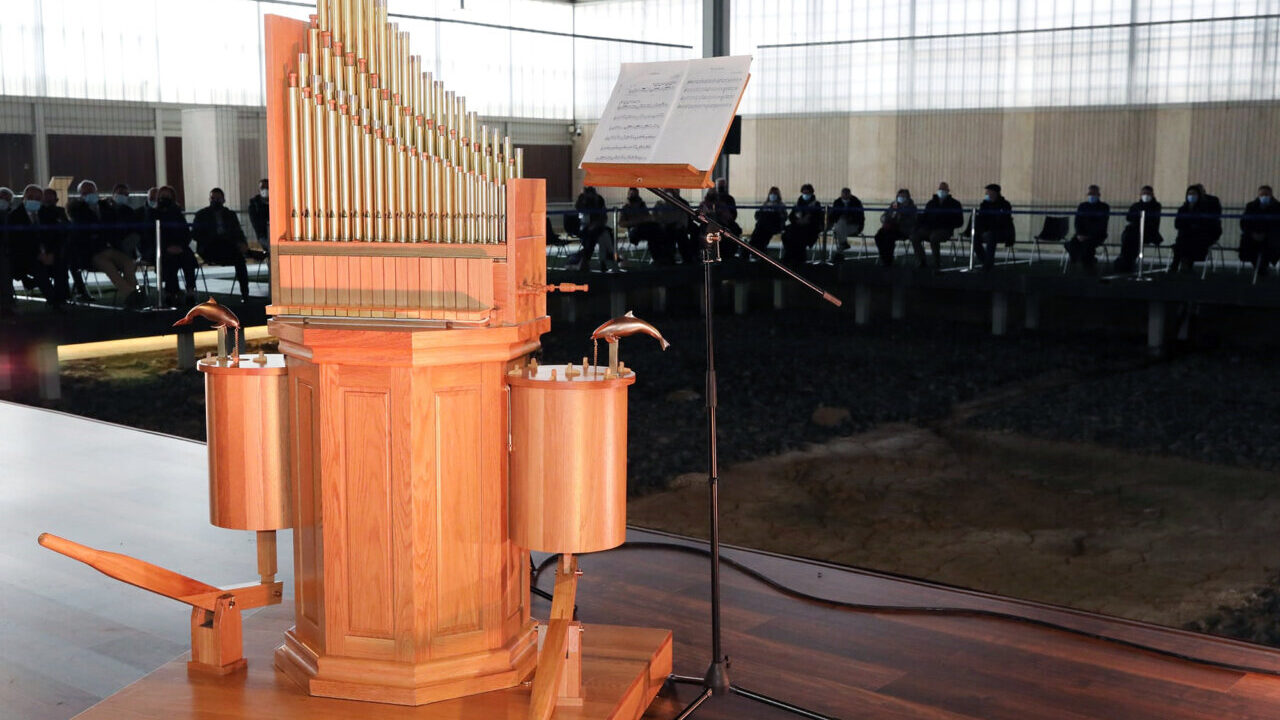 Instrumento hydraulis en la villa romana durante una demostración