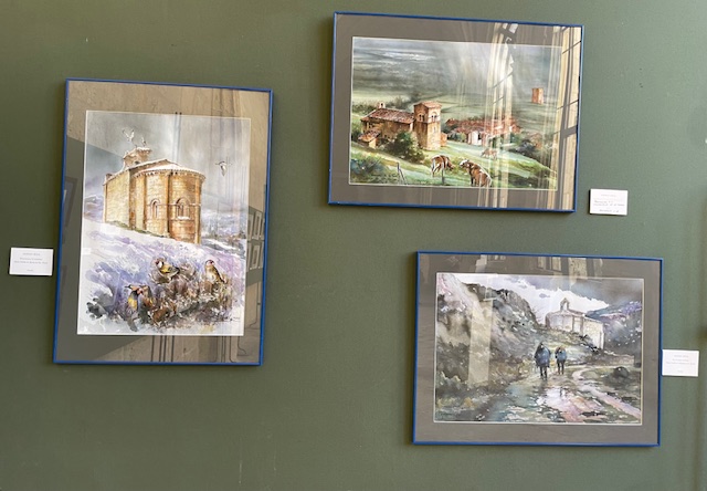 Tres acuarelas enmarcadas de la exposición de arte románico en Palencia