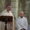 Ceremonia de bautizo en la iglesia San Miguel con un obispo y un sacerdote.