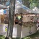 Stand de la Diputación de Palencia en una feria local con productos alimentarios