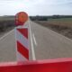 Carretera en Palencia con señal de advertencia de obras