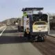 Máquina de asfaltado en la autovía A-67 cerca de Herrera de Pisuerga