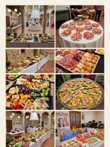 Mesa de catering con variedad de platos y decoraciones en un evento