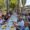 Grupo de personas disfrutando de una paellada en las fiestas de Husillos
