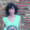 Elisa Hermano posando frente a una pared de ladrillos