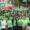 Participantes con camisetas verdes en la Carrera contra el Cáncer en Palencia.