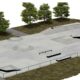 Render de un skatepark con bowl, rampas, barandillas y árboles alrededor
