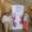 Tres mujeres posan junto al cartel del III Congreso de Trabajo Social Forense.